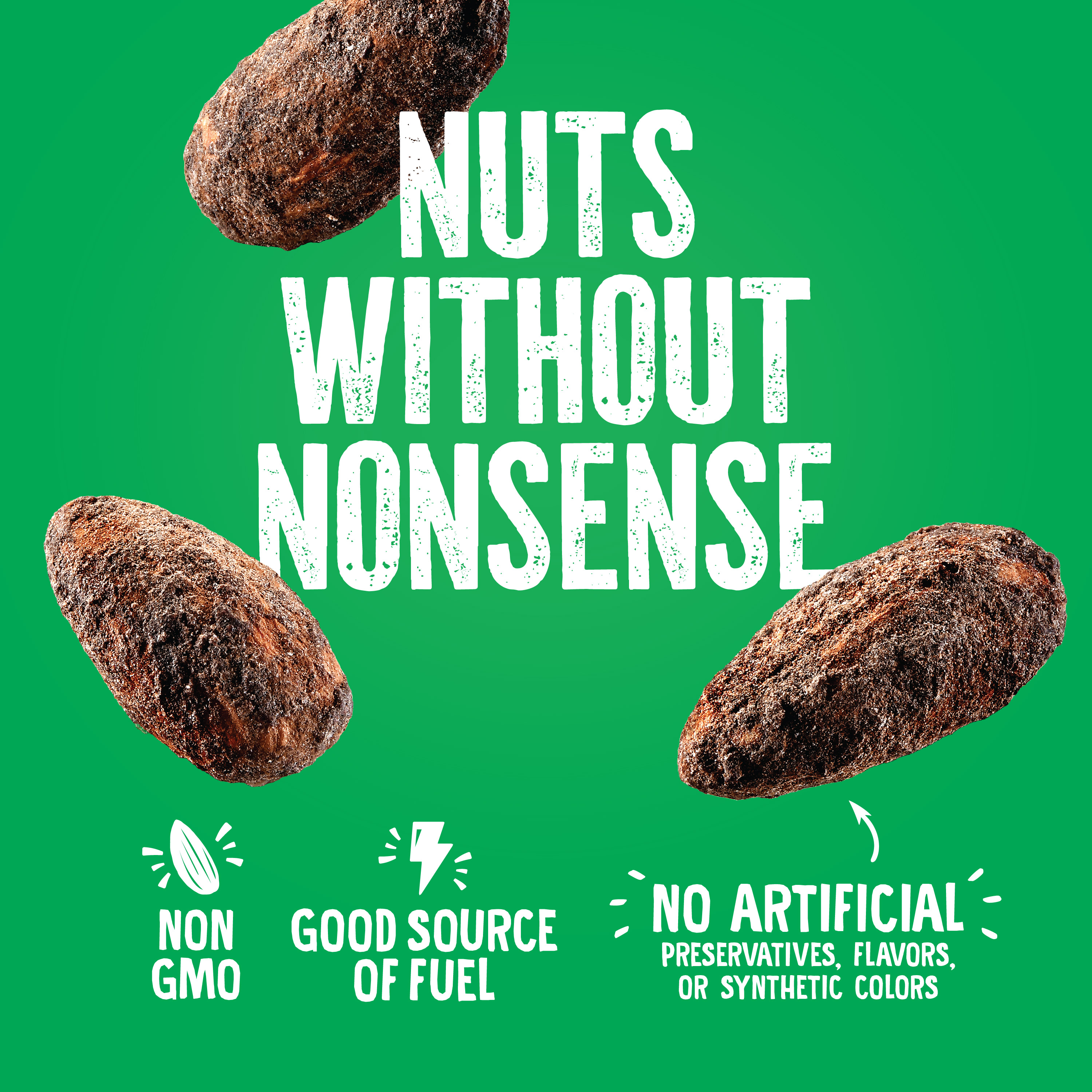 A green advertisement with large text NUTS WITHOUT NONSENSE and images of nuts. Icons below say NON GMO, GOOD SOURCE OF FUEL, and NO ARTIFICIAL PRESERVATIVES, FLAVORS, OR SYNTHETIC COLORS.