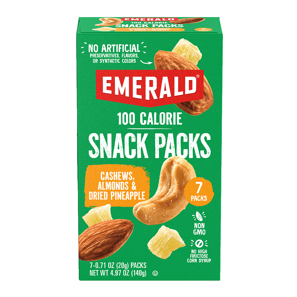 Box of Emerald 100 Calorie Snack Packs. Green packaging with images of cashews, almonds, and dried pineapple. Text highlights No Artificial Preservatives, Non-GMO, and 7 Packs. Weight: 4.97 oz (140g).